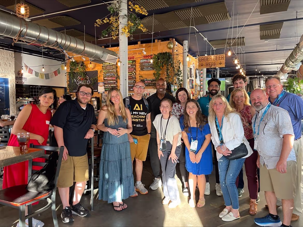 Brisk Team standing together at a bar - Brisk Teaching images